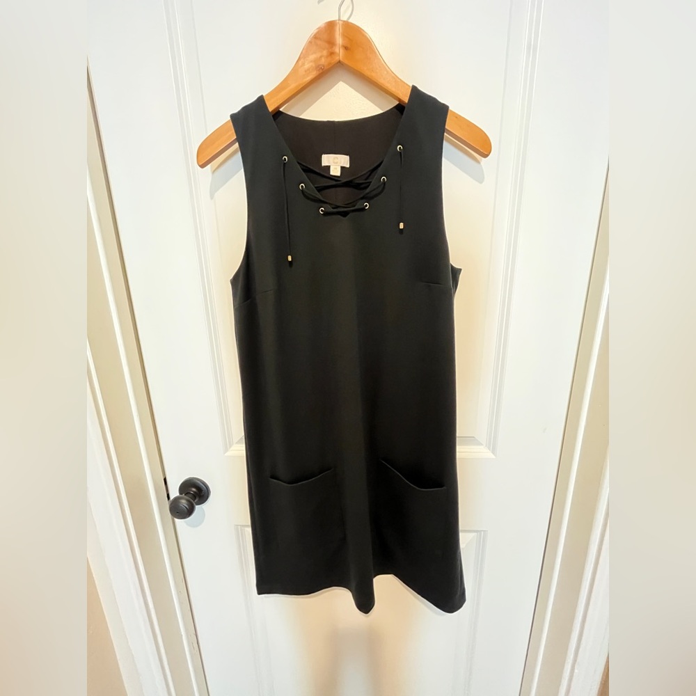 C Black Lace-Up Lined Mini Dress. Two front pockets.